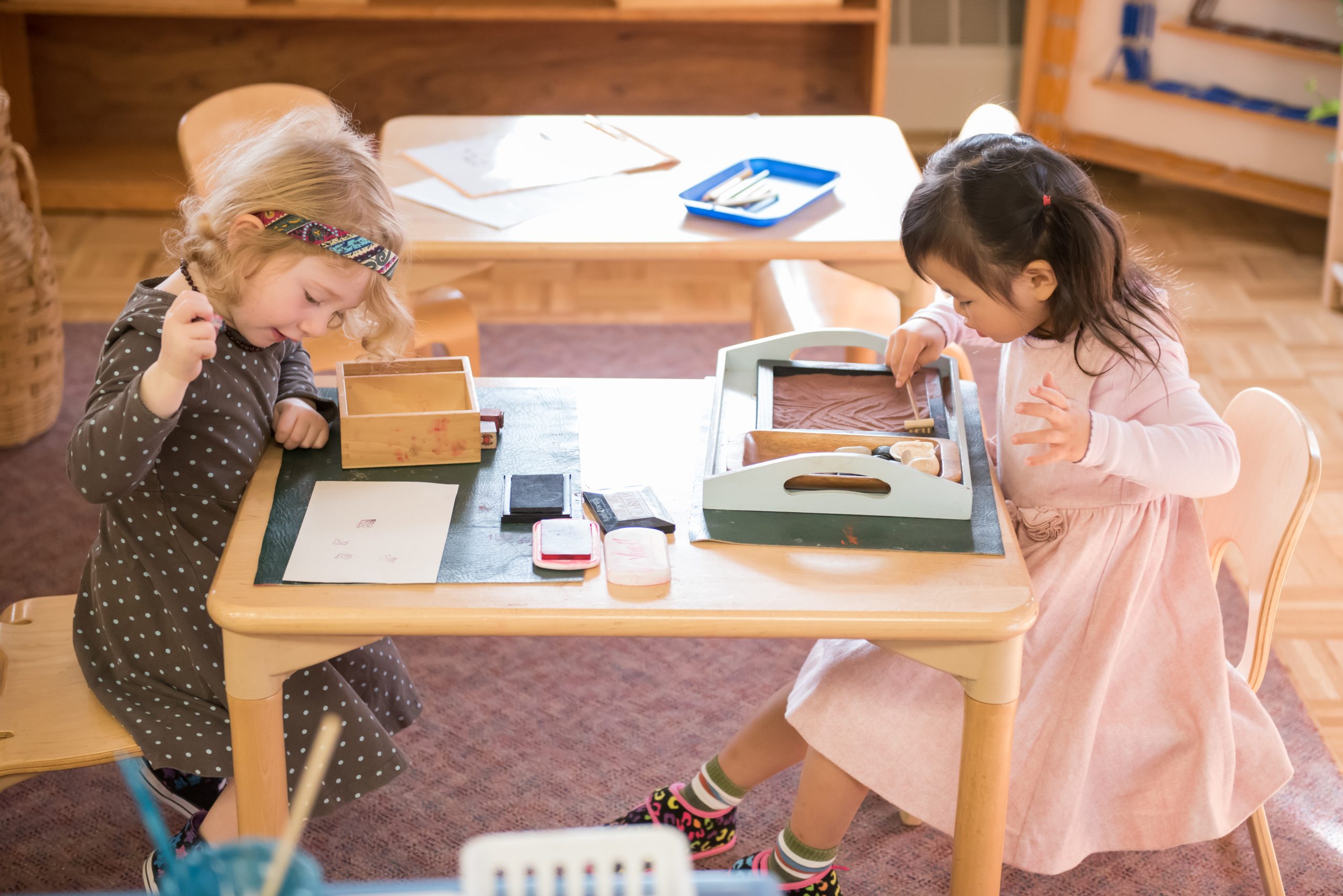 Montessori Children's House students work on a sensorial activity