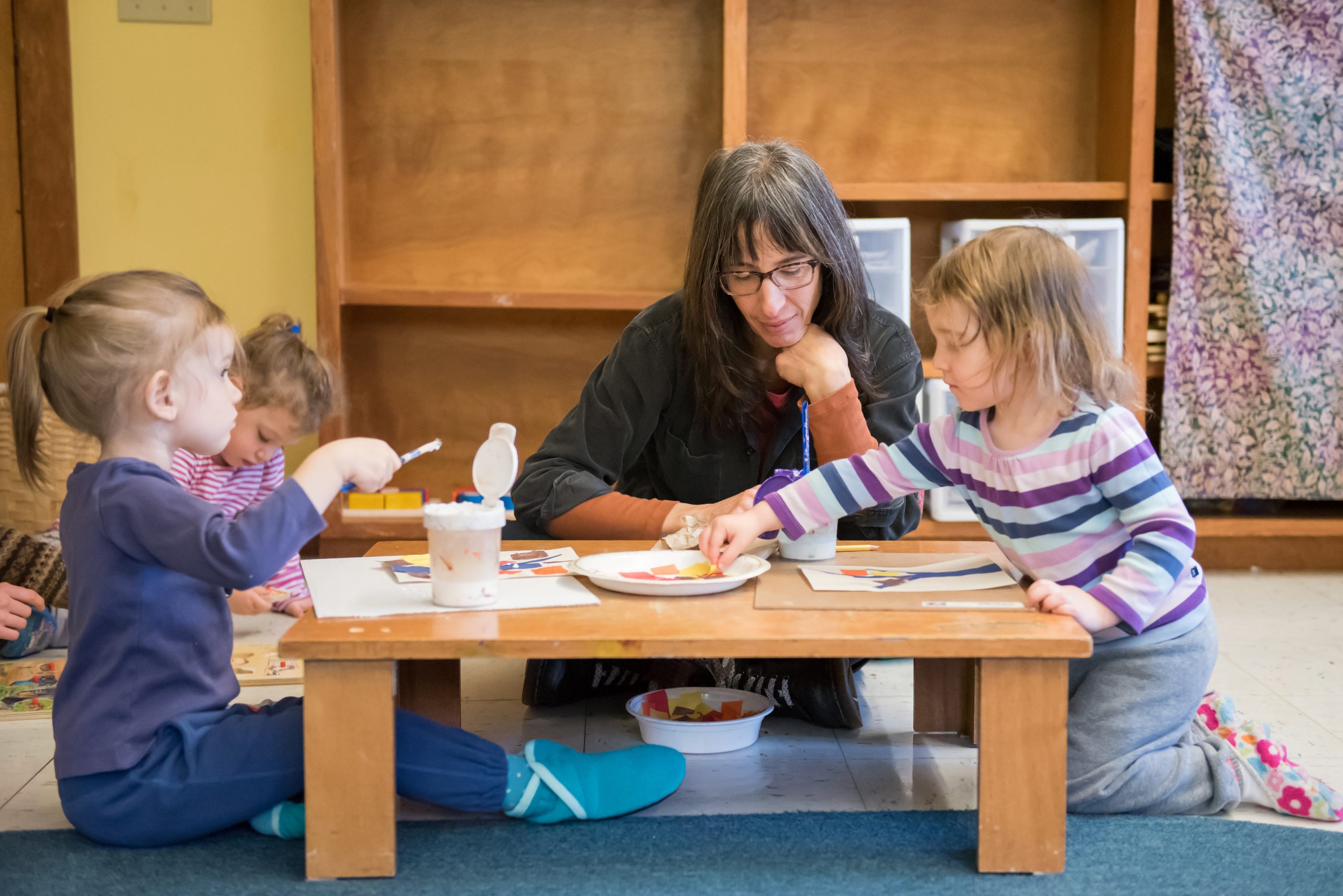 Toddlers participate in an art project