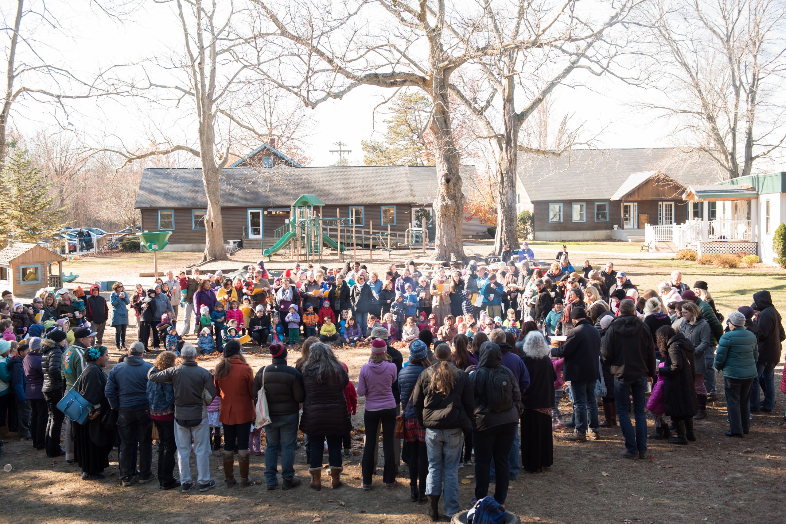 The Montessori School of Northampton community attends a Harvest Gathering. 