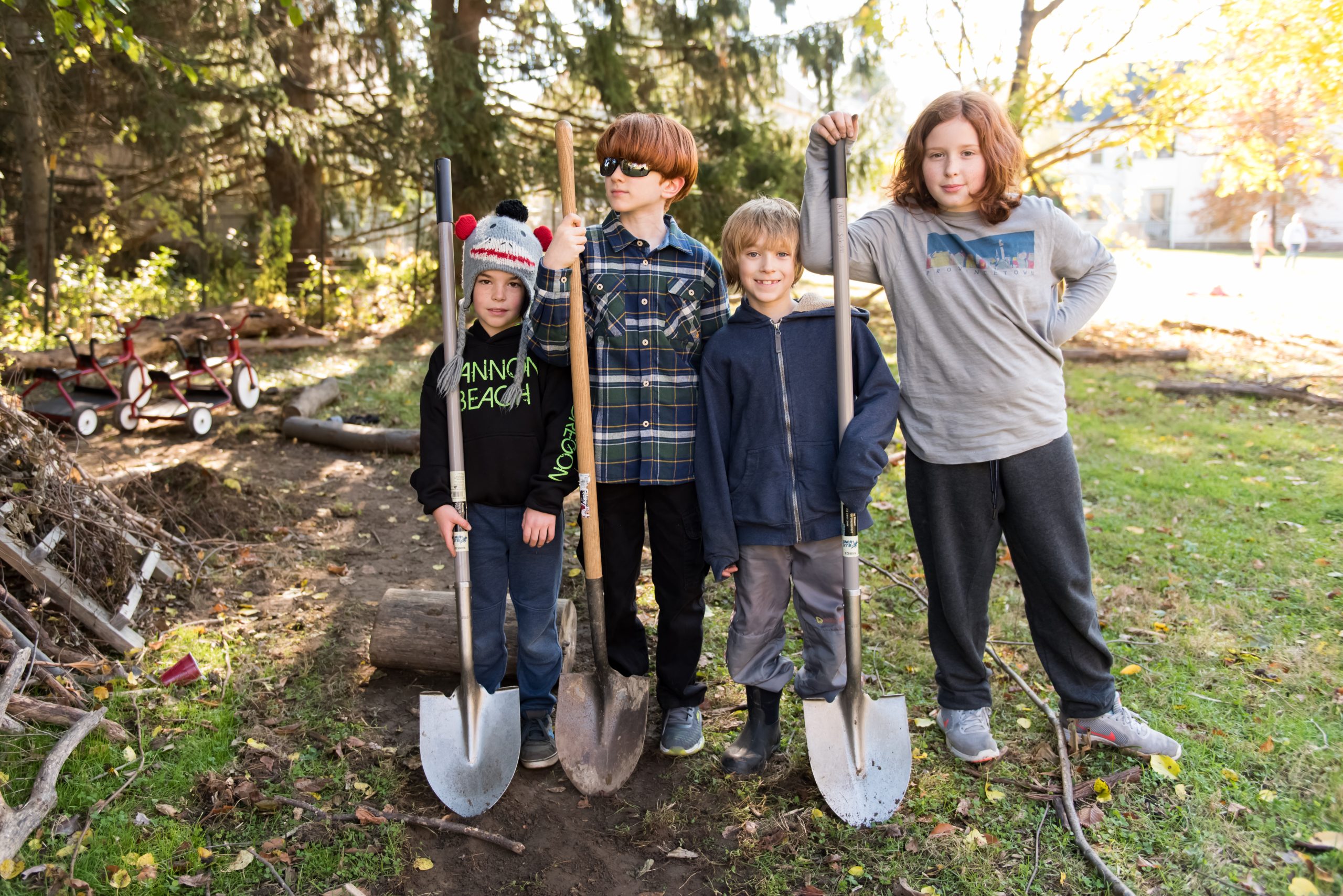 Montessori elementary students work on an outdoor enrichment project